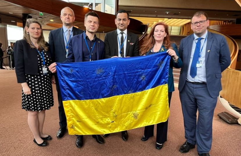 Gagan holding a Ukrainian flag