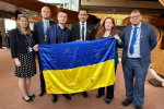 Gagan holding a Ukrainian flag
